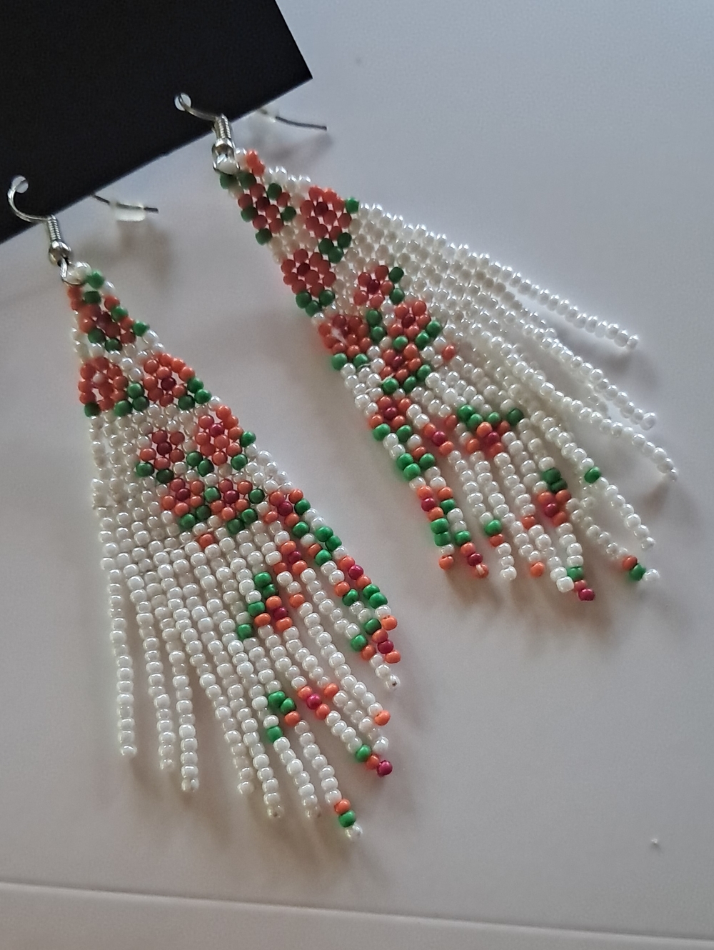 White Seed Bead Fringe Earrings with Coral and Green Floral Accents
